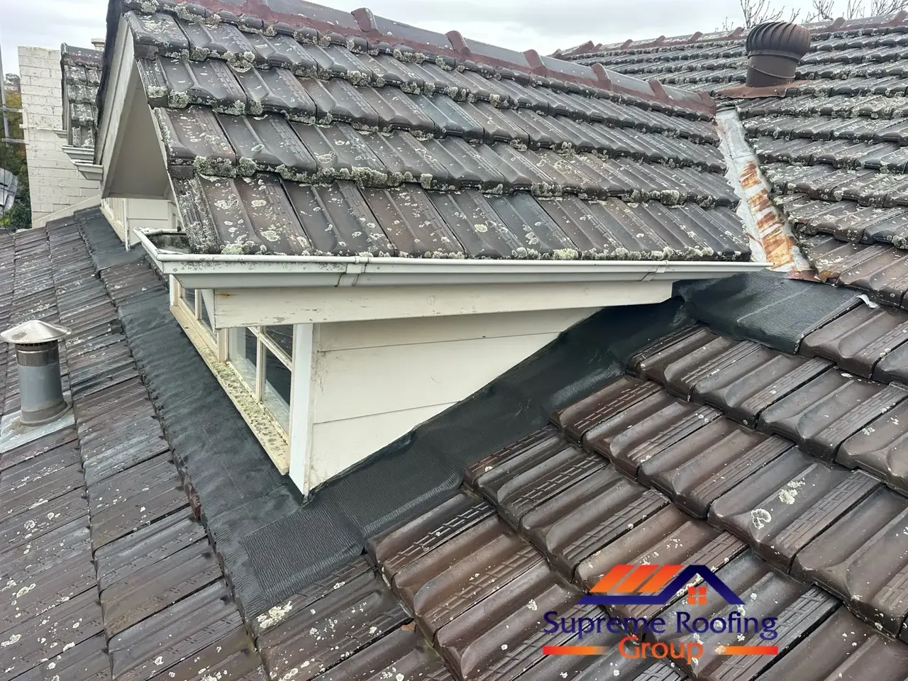 Completed apron flashing replacement around terracotta roof and dormer walls in Canterbury