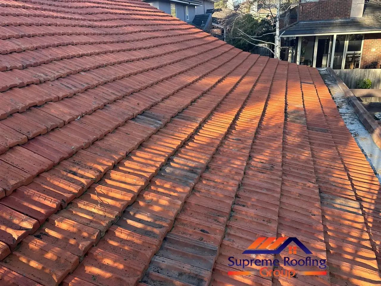 Completed terracotta tiled roof after batten and sarking replacement in Murrumbeena