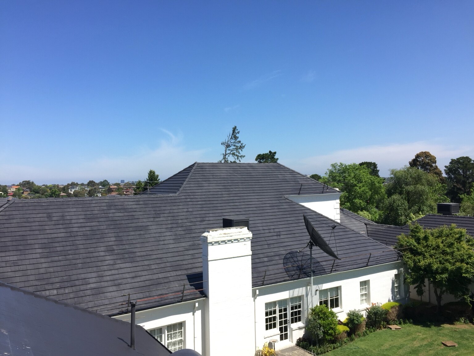 Completed high-pitched charcoal cement tile roof restoration in Templestowe