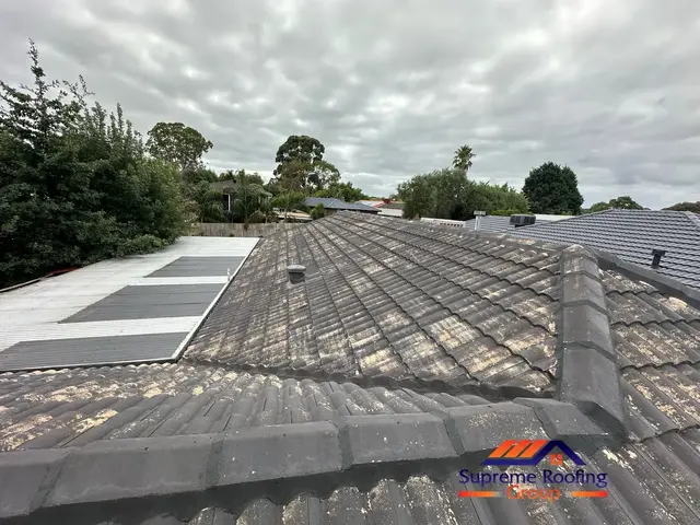 Weathered cement tile roof and ridge pointing before restoration in Bentleigh East