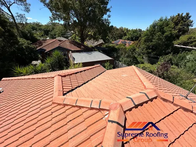 Repointed ridge caps during a Blackburn roof restoration