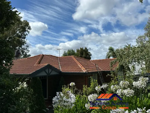 Blackburn home before cement tile roof restoration