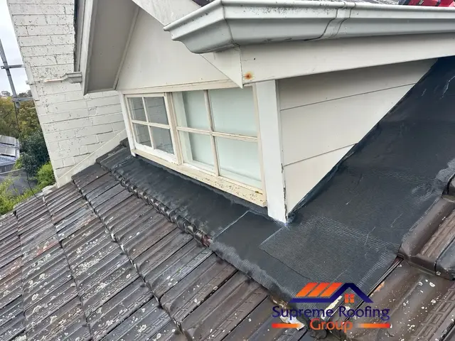 Replacement apron flashing formed beneath the window and along the terracotta tiles in Canterbury