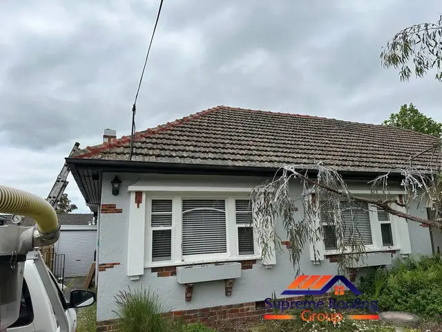 Completed Carnegie roof repair with broken tiles replaced and ridge capping repointed