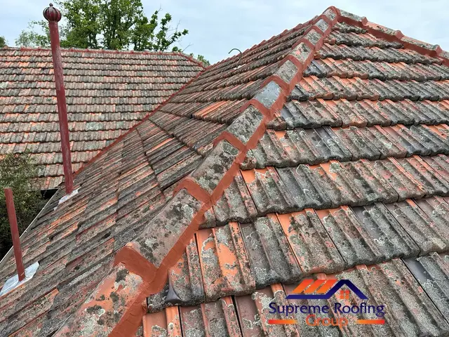 Freshly repointed hip capping on a terracotta roof in Carnegie