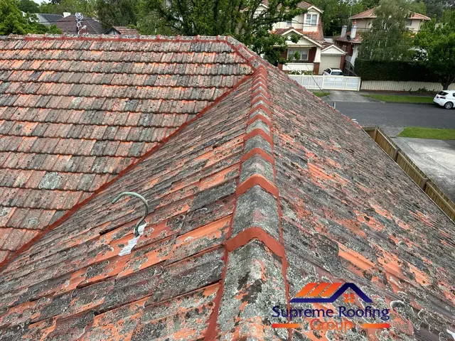 Repointed ridge and hip junction on a Carnegie terracotta roof