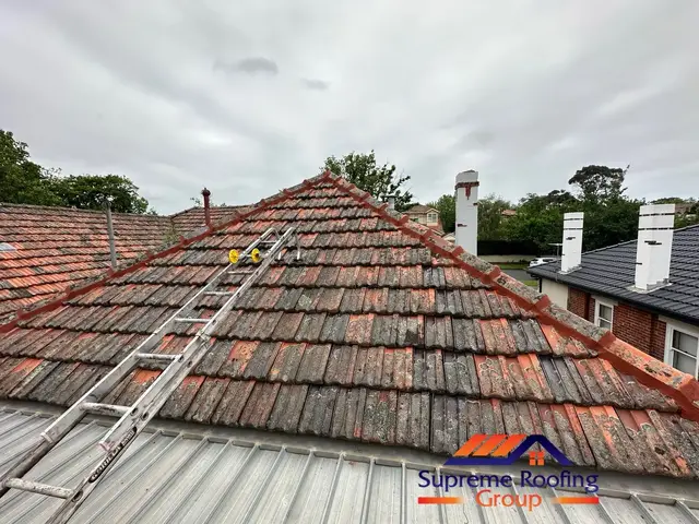 Original ridge pointing condition on a Carnegie terracotta roof