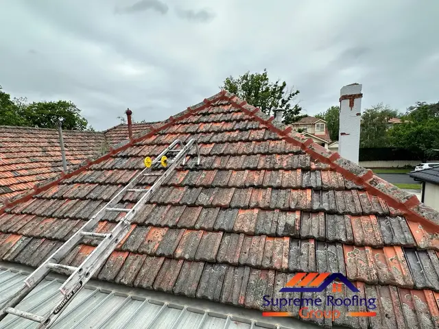 Terracotta tile repairs and ridge preparation underway in Carnegie