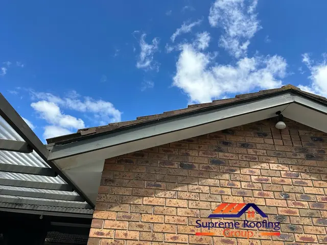 Deteriorated fascia and scotia boards on the left side of a Croydon Hills roof gable