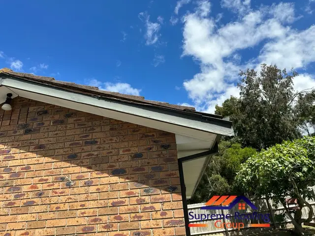 Deteriorated fascia and scotia boards on the right side of a Croydon Hills roof gable