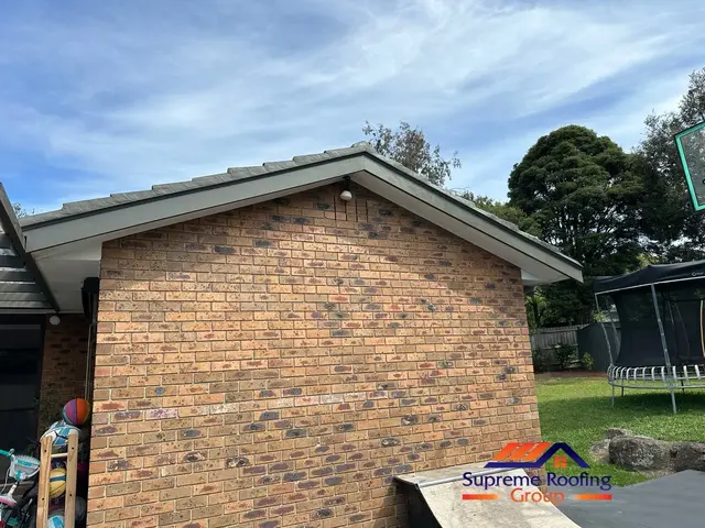 Repaired left gable with new fascia and scotia boards painted Woodland Grey in Croydon Hills
