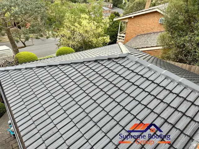 Completed Doncaster East cement tile roof restoration in Charcoal