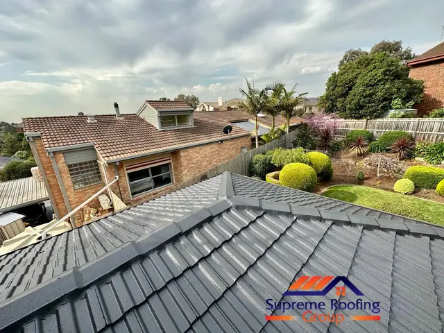 Repointed ridge capping and cement tiles finished in Charcoal in Doncaster East