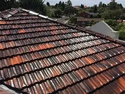 Restored terracotta roof tiles showing the completed finish in Doncaster East