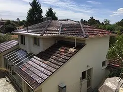 Finished terracotta roof restoration viewed across the Doncaster East home