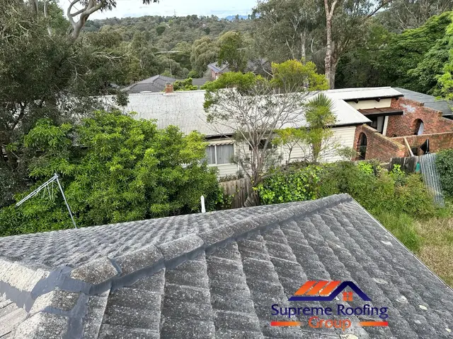 Finished cement tile roof planes with renewed ridge capping in Doncaster