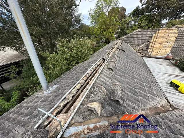 Ridge caps lifted and old bedding exposed during roof repair in Doncaster