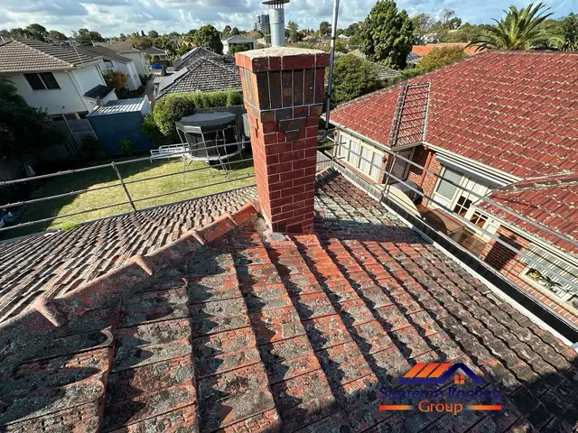 Terracotta roof condition around the chimney before restoration in Elsternwick