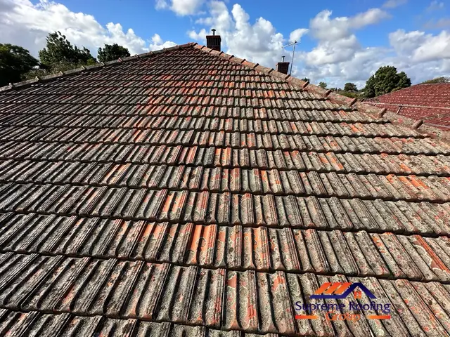 Weathered terracotta roof tiles before pressure cleaning in Elsternwick
