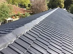 Midnight colour coating being applied to the Glen Waverley tiled roof