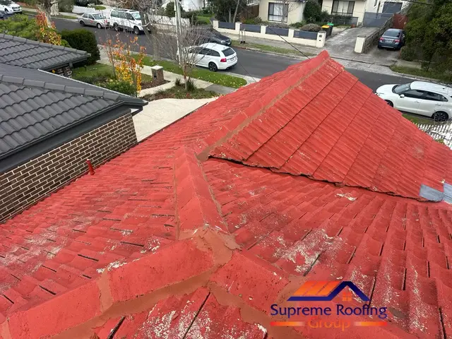 Cement tile roof repairs underway before painting in Huntingdale
