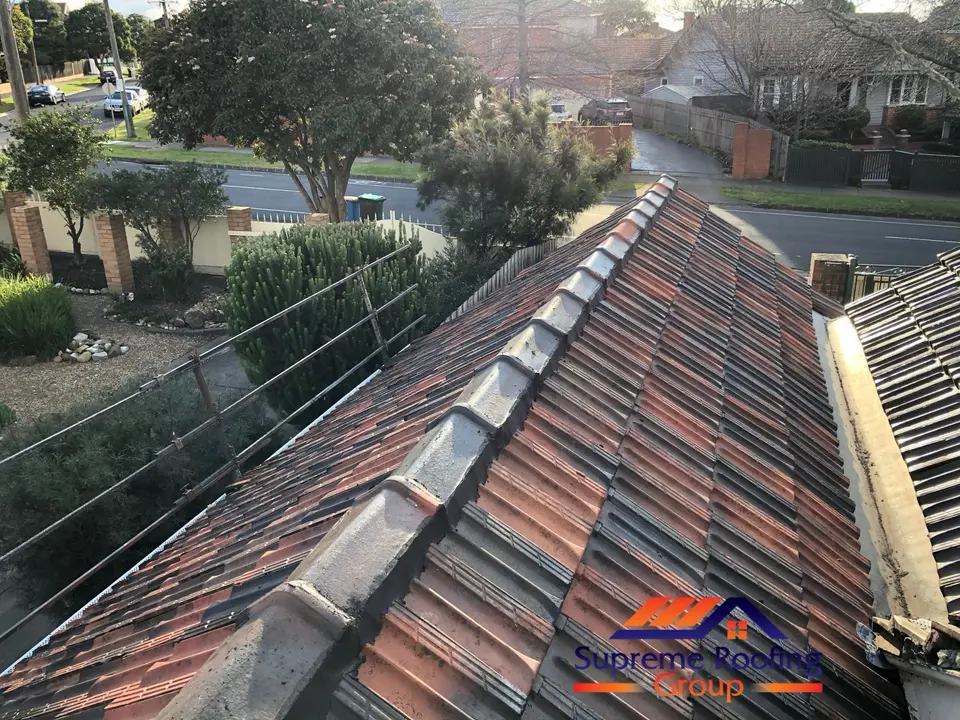 Ridge and hip lines being repointed on the Kew terracotta roof