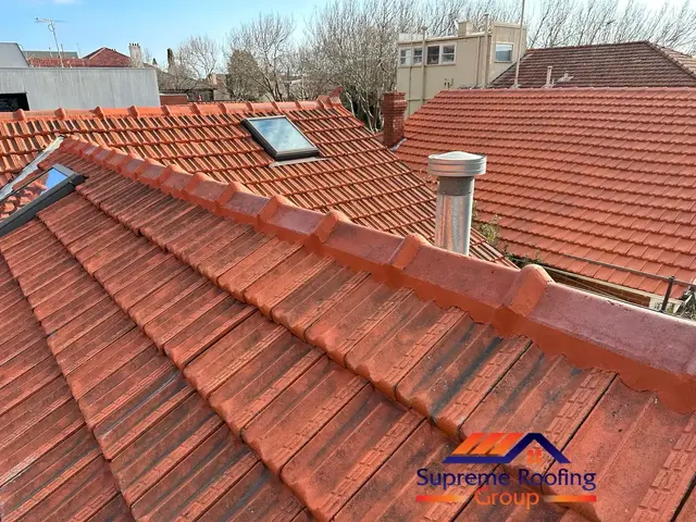 Freshly repointed terracotta ridge capping on a St Kilda roof