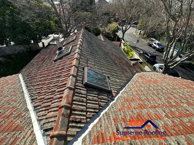 Weathered terracotta roof and ridge capping before restoration in St Kilda