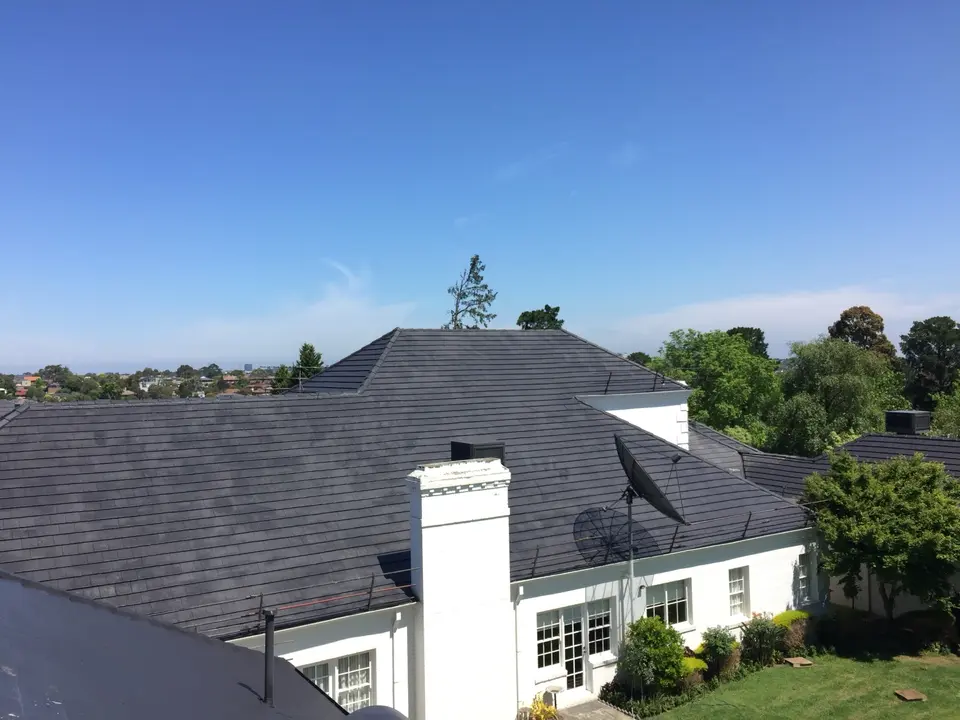 Completed high-pitched charcoal cement tile roof restoration in Templestowe