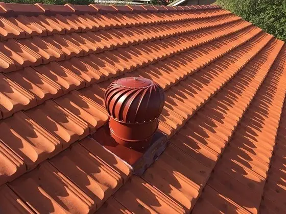 Roof ventilation turbine installed on a terracotta tiled roof in Melbourne