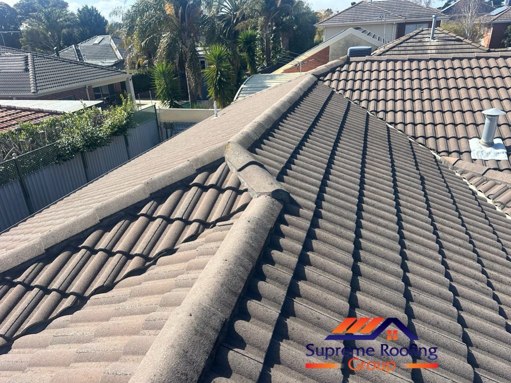 Existing ridge capping and weathered pointing on the Bentleigh East tiled roof before repair