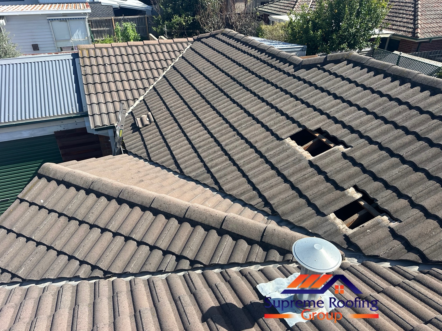 Roof tiles lifted during targeted repairs on a Bentleigh East cement tile roof