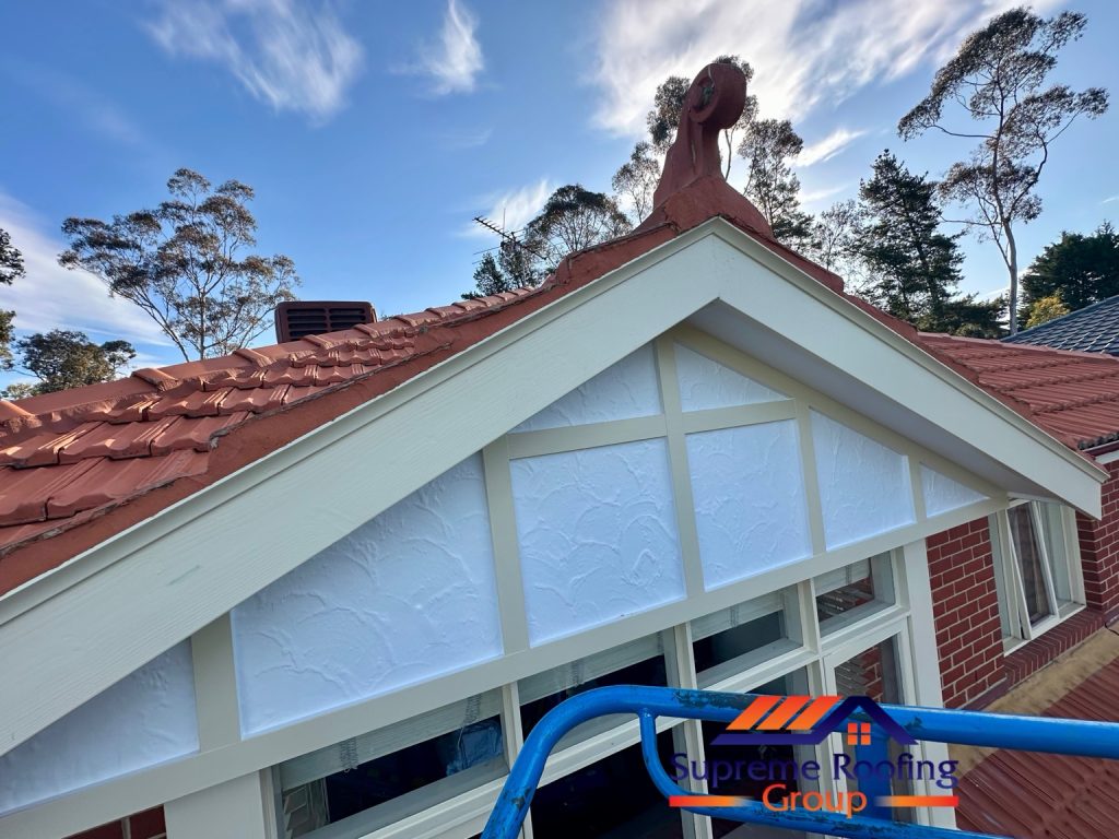 Completed terracotta-coloured pointing along the Diamond Creek roof gable