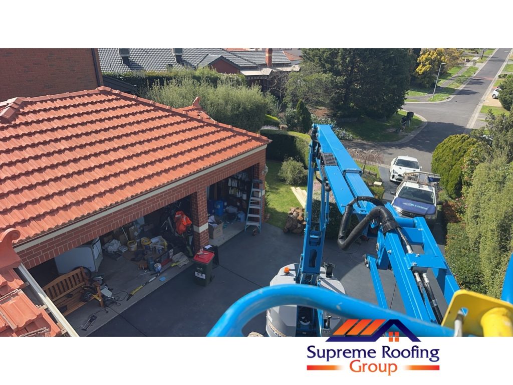 Elevated work platform beside the terracotta roof at the Diamond Creek project