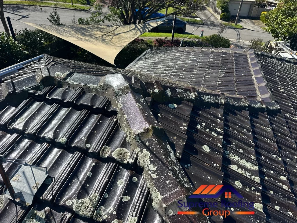 Weathered pointing at a ridge and hip junction before Donvale roof repairs