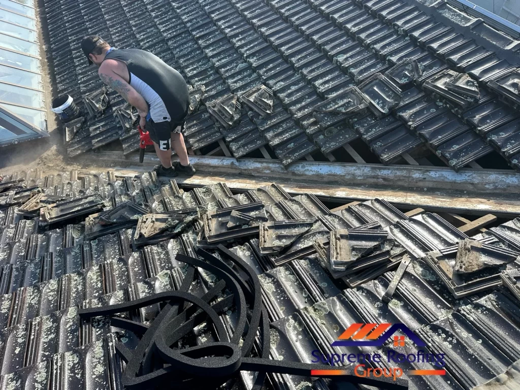 Lifted valley tiles and exposed existing valley during storm-seal preparation in Donvale