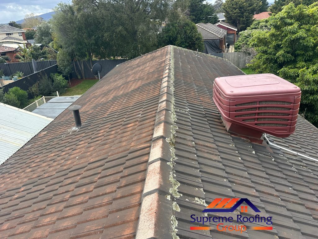 Weathered tiled roof and existing ridge pointing before restoration in Rowville