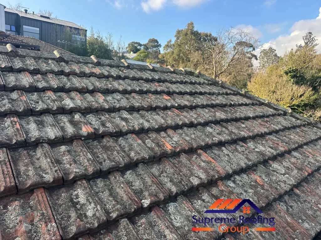 Existing terracotta tiles and ridge capping before the Surrey Hills roof repairs
