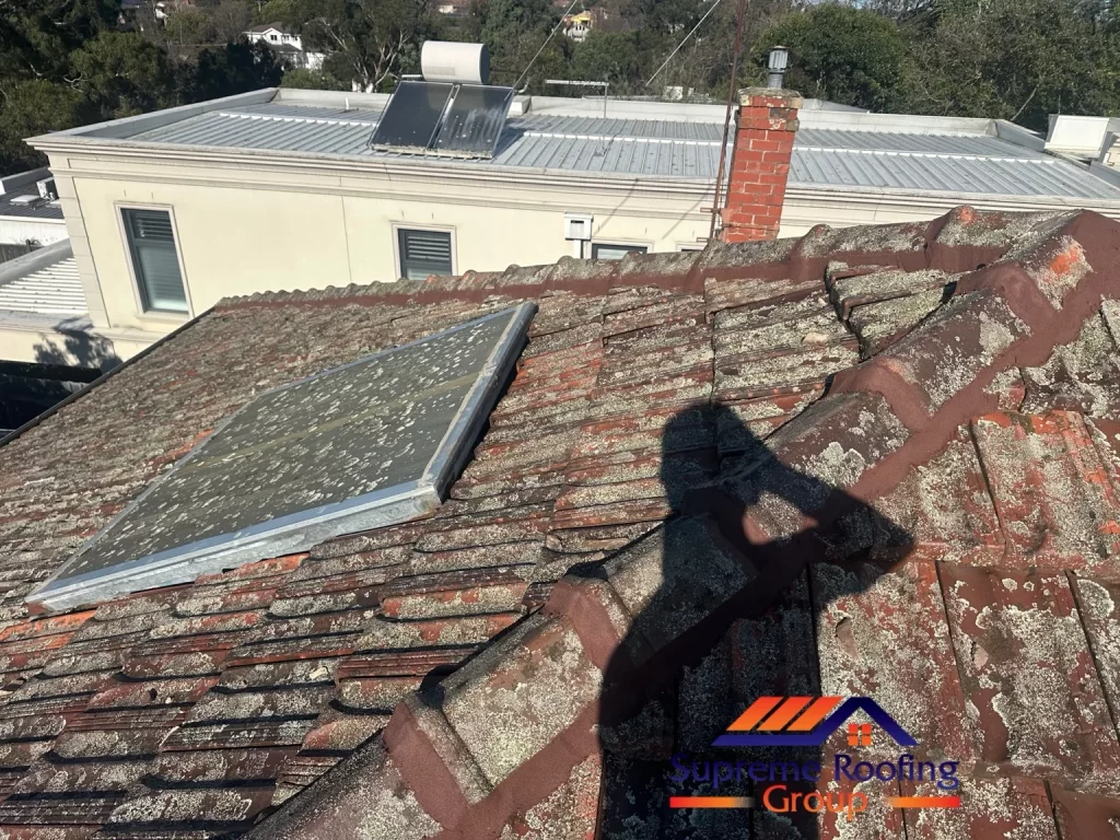 Repointed hip and ridge junction beside the roof skylight