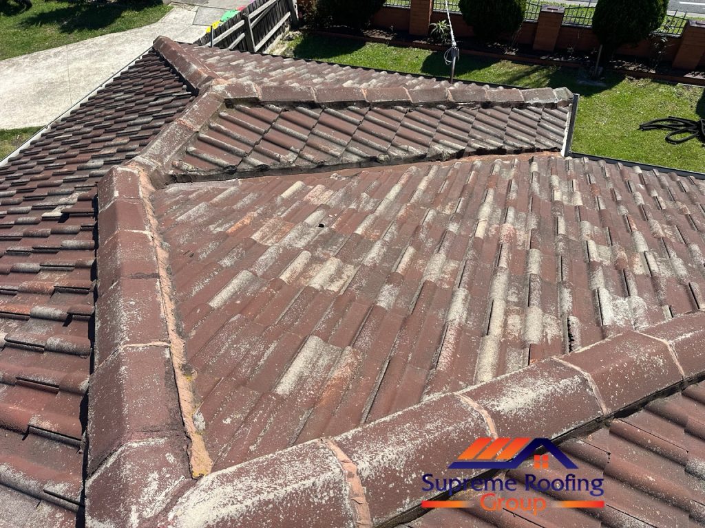 Deteriorated mortar along hip caps and valley edges on the Thomastown tiled roof