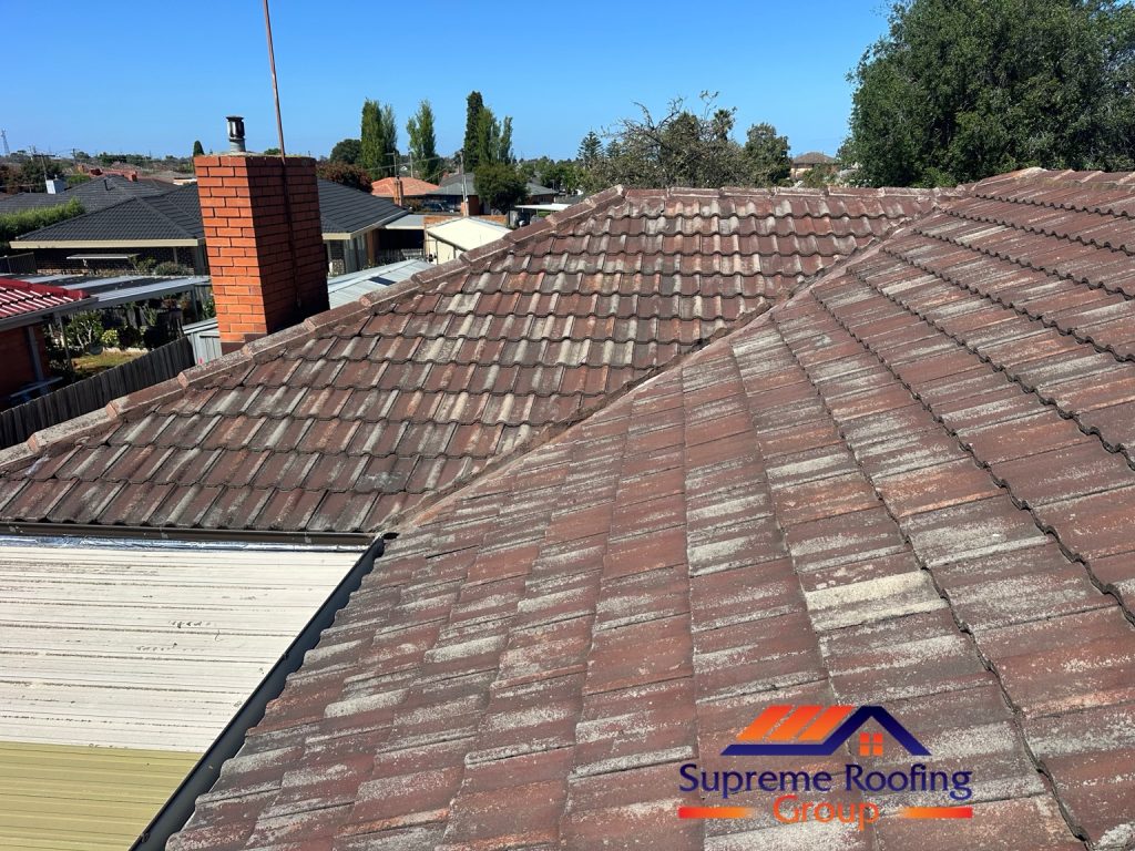 Weathered tiled roof, ridge caps and valley at the Thomastown property before repairs