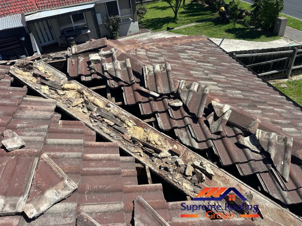 Roof tiles lifted to expose the deteriorated valley and old mortar during Thomastown roof repairs