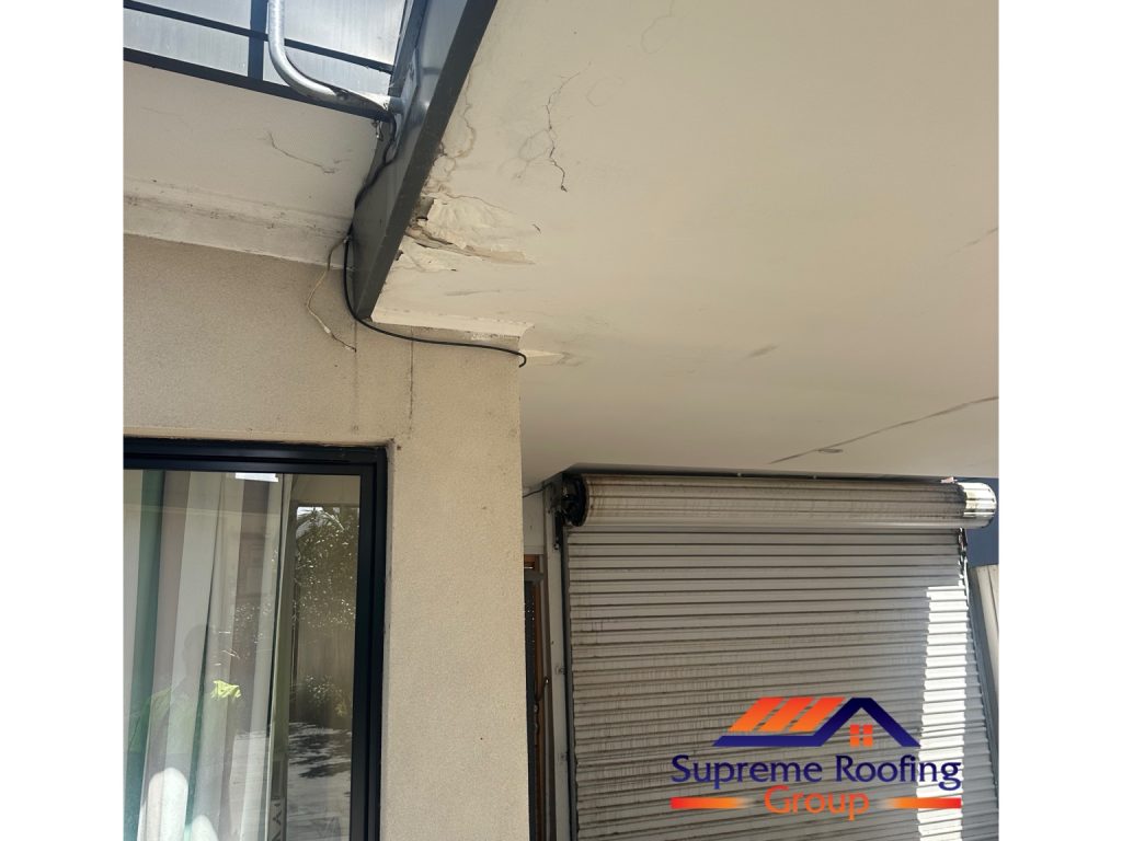 Damaged soffit lining below a roof junction before metal roof leak repairs in Toorak